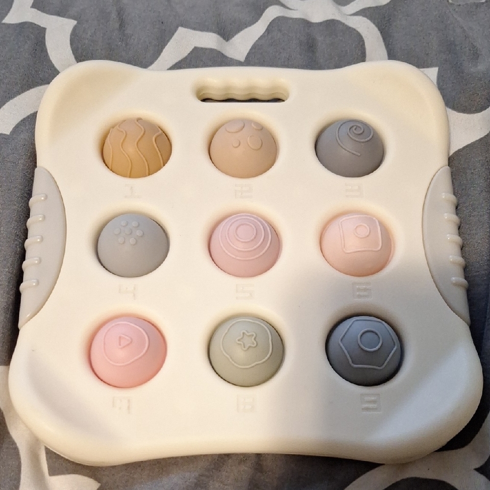 Interactive Sensory Toy with Pastel Colors